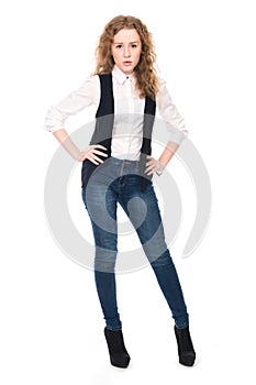 Portrait of young business girl with curly hair in jeans