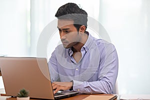 Portrait of Young business indian man working