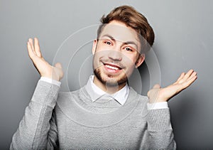 Portrait of a young business man surprised face expression