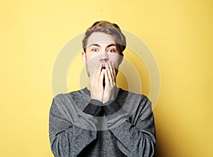 Portrait of a young business man surprised face expression