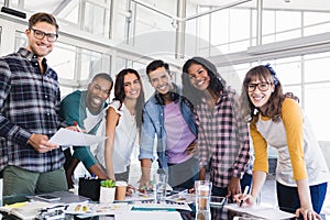 Portrait of young business team discussing at creative office