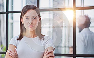 business woman with her staff in background at office photo