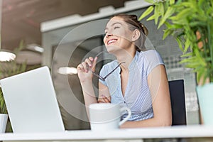 Portrait of a young business woman in an office