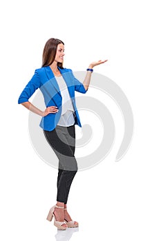 Portrait of young business woman pointing on white background