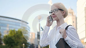 Portrait of Young Business Woman Typing Text Message On Phone Outdoors