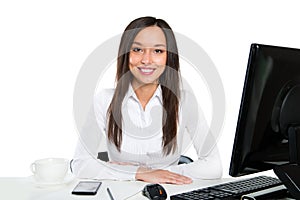 Portrait of a young business woman using computer at office