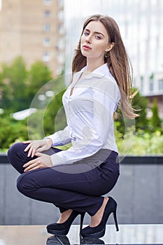 Portrait, young business woman in white shirt