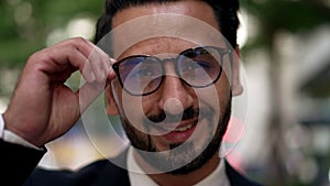 Portrait Young businessman with beard wearing glasses smiling with shy