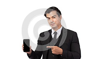 Portrait young businessman working on new tablet, mobile phone in white studio. Portrait of a confident business man in black suit