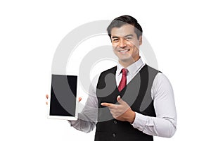 Portrait young businessman working on new tablet, mobile phone in white studio. Portrait of a confident business man in black suit