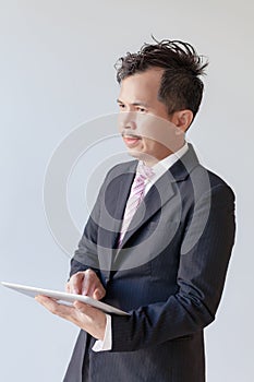 Portrait young businessmen using touchpad.