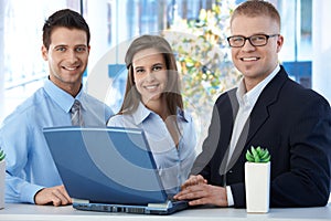 Portrait of young businessteam with laptop
