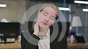 Portrait of Young Businesswoman having Neck Pain