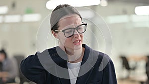 Portrait of Young Businesswoman having Neck Pain