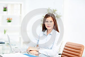 Portrait of a young businesswoman in office