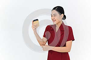 Portrait of a young businesswoman posing with paper cup of coffee or tea, isolated on white background. Achievement career wealth