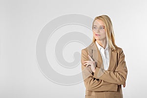 Portrait of young businesswoman on white background. Space for text