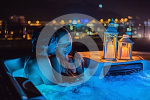 Portrait of young carefree happy smiling couple relaxing at hot tub during enjoying happy traveling moment vacation life photo