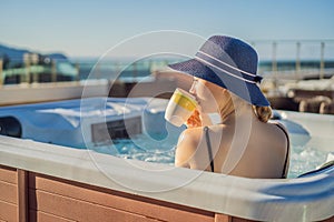 Portrait of young carefree happy smiling woman relaxing at hot tub during enjoying happy traveling moment vacation life