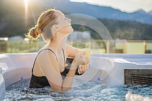 Portrait of young carefree happy smiling woman relaxing at hot tub during enjoying happy traveling moment vacation life