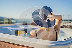 Portrait of young carefree happy smiling woman relaxing at hot tub during enjoying happy traveling moment vacation life