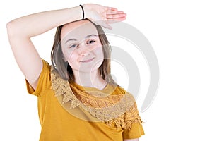 Portrait of young casually dressed woman posing