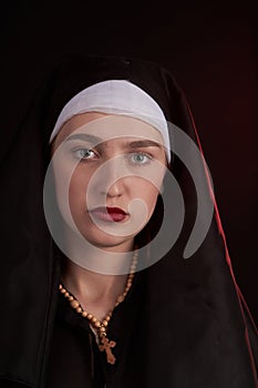 Portrait of a young caucasian christian nun sister girl.
