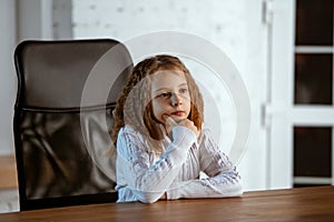 Portrait of young caucasian girl in casual clothes looks dreamful and happy