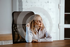 Portrait of young caucasian girl in casual clothes looks dreamful and happy