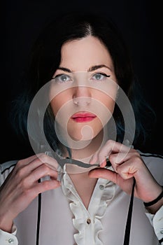 Portrait of a young caucasian woman with blue colored hair