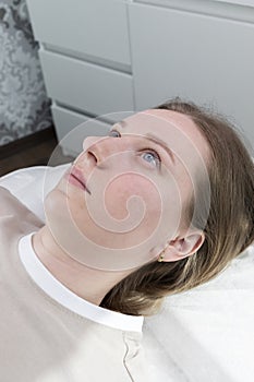 Portrait Of Young Caucasian Woman After Eyelash Lamination Procedure, Lash Treatment Lying