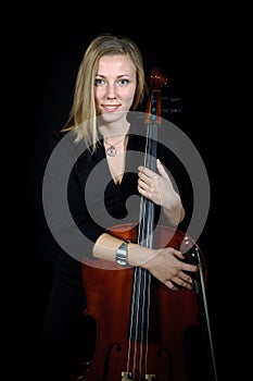 Portrait of young cellist with cello