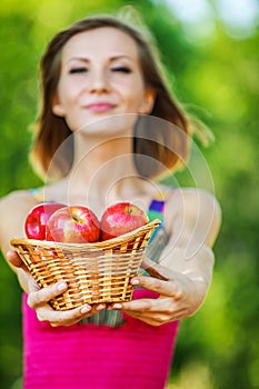 Portrait young charming woman basket apples