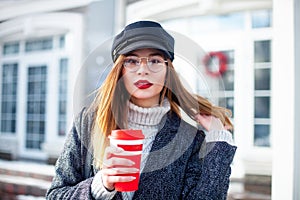 Portrait of young charming woman wearing fashionable glasses, red lips, business lady in elegant jacket , cute student in stylish