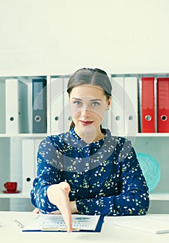 Portrait of young cheerful beautiful business woman giving hand for handshake.