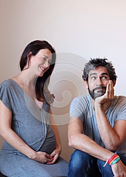 Portrait of a young cheerful pregnant couple