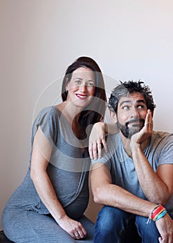 Portrait of a young cheerful pregnant couple