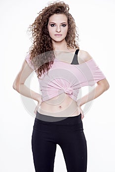 Portrait of a young cheerful woman standing on white background