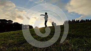 Portrait of young child girl playing with white dog Japanese spitz puppy