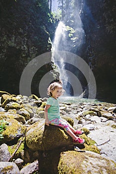 Portrait of a Young Child by Waterfall