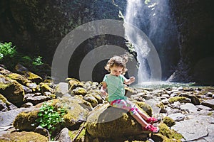 Portrait of a Young Child by Waterfall