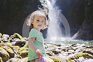 Portrait of a Young Child by Waterfall