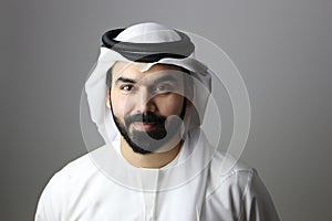 Portrait Of A Young Confident Arab Businessman Wearing UAE Emirati Tradational Dress