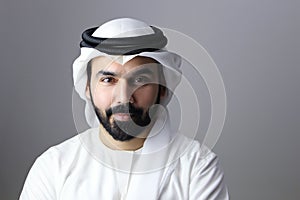 Portrait Of A Young Confident Arab Businessman Wearing UAE Emirati Tradational Dress