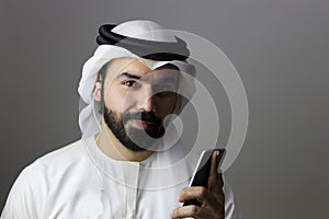 Portrait Of A Young Confident Arab Businessman Wearing UAE Emirati Tradational Dress