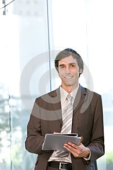 Portrait of young confident business man in focus