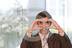 Portrait of young confident business man in focus