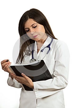 Portrait of young confident female doctor holding folder