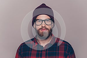 Portrait of young confident serious hipster man in glasses
