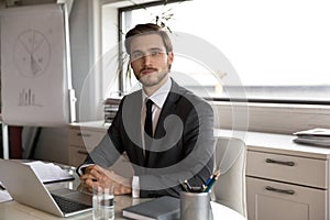 Portrait of young confident skilled handsome male manager. photo